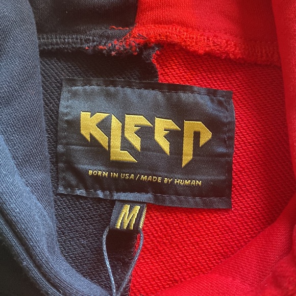 I'm selling a brand new sweater, black and red really nice designs - Picture 2 of 4